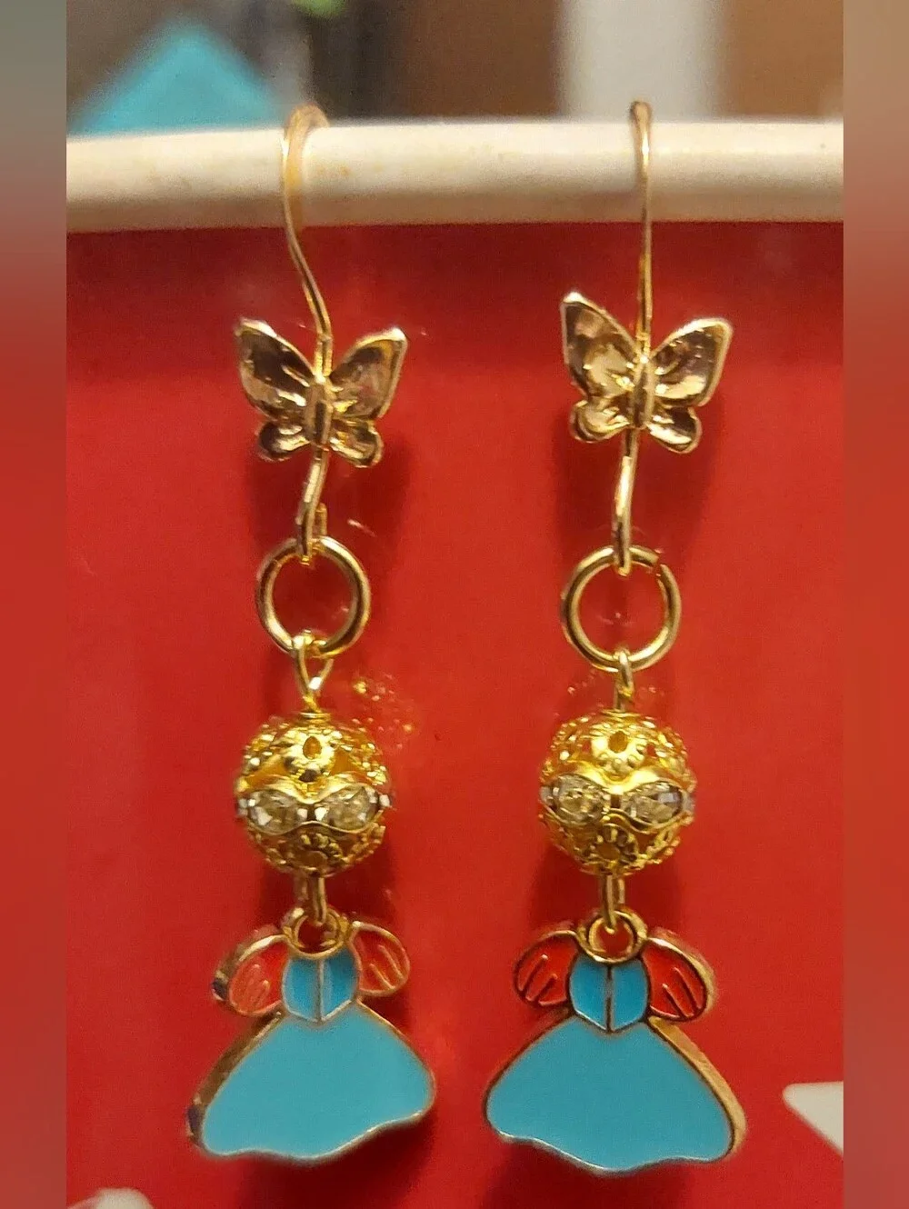 Gold Butterfly Drop Earrings with Turquoise and Red Enamel Accents